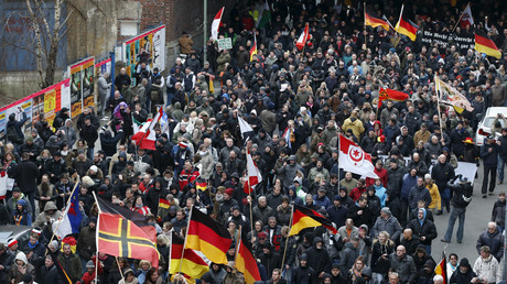 Far right-wing supporters march during rally against the German government's immigration policies and migrants, near-by the Chancellery in Berlin, Germany, March 12, 2016. © Fabrizio Bensch