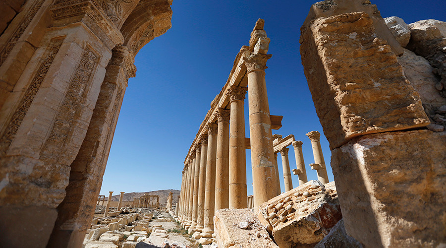 Palmyra mass grave: Tortured women & children among dozens of ISIS victims unearthed by Syrian Army