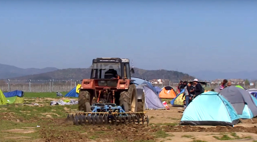 Outraged Greek farmer plows tractor through refugee camp (VIDEO)