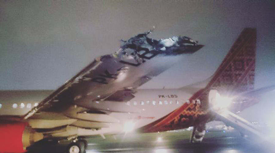 Wing & tail ripped off as 2 planes collide on takeoff in Indonesia (PHOTOS, VIDEO)