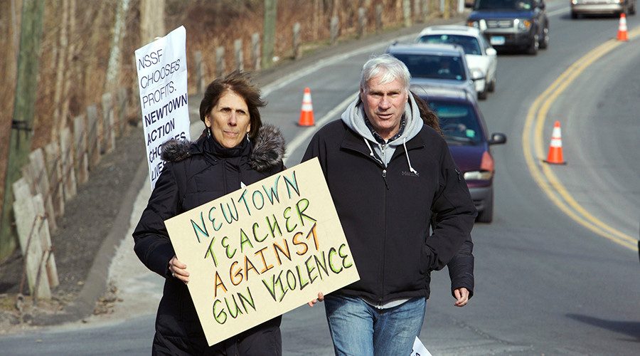 Newtown teacher arrested after bringing gun to school