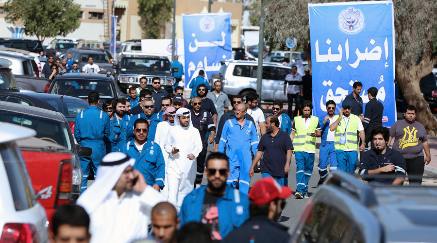 Thousands of Kuwait oil workers go on strike against pay cuts
