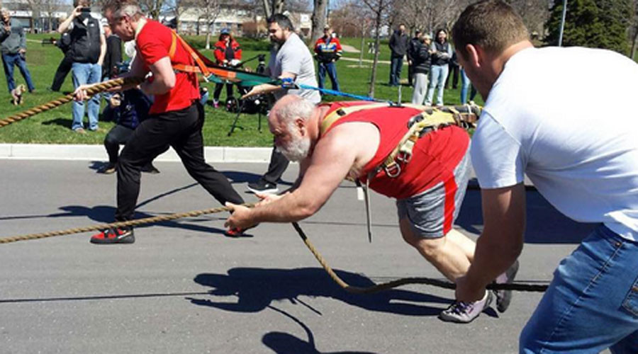 ‘World’s strongest pastor’ pulls 3 fire trucks 100ft to set new Guinness record