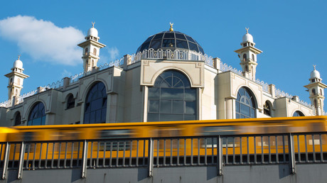 A U-Bahn metro train drives past the Mevlana Mosque in Berlin's Kreuzberg district © David Gannon