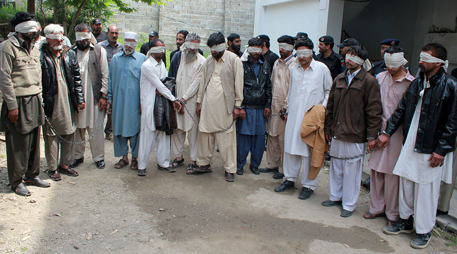 Members of a tribal council accused of ordering the burning death of a 16 year old girl are shown to the media after they were arrested by police in Donga Gali, outside Abbottabad, Pakistan May 5, 2016. © Online News