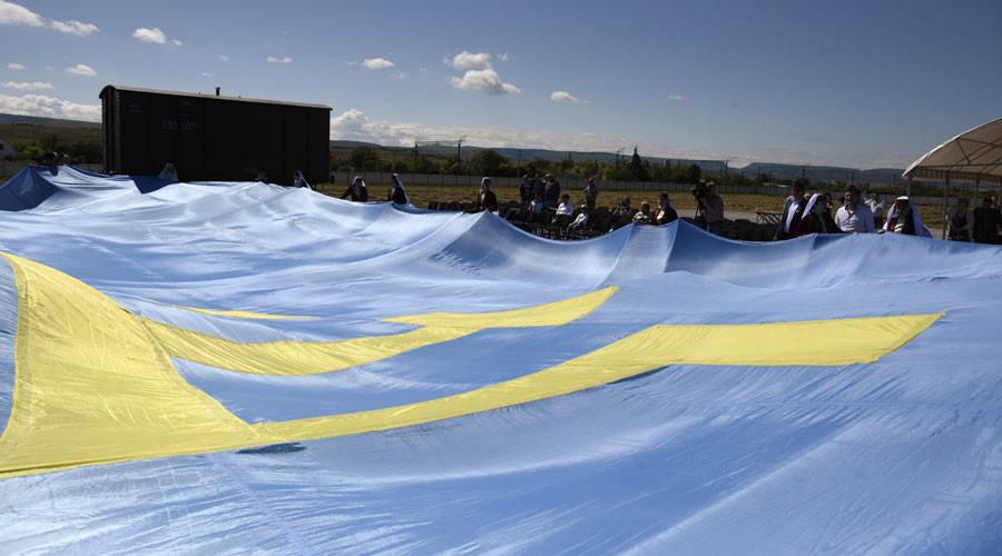 An opening ceremony of the memorial site to victims of deportation of Crimean Tatars at Siren railway station, Bakhchysarai district (replica of a cattle wagon carrying first group of the Tatars deported from Crimea to Central Asia in 1944) © Alexander Polegenko