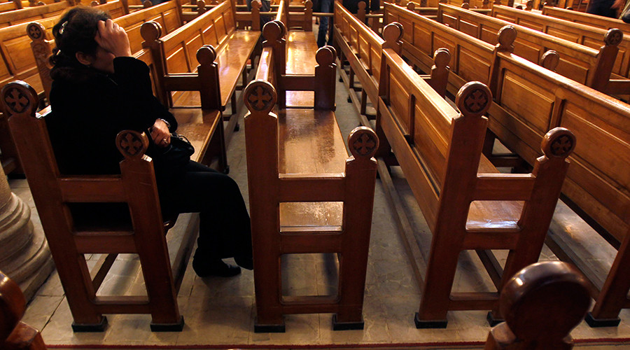 An Egyptian Christian woman in a Coptic Orthodox church in Alexandria © Amr Abdallah Dalsh