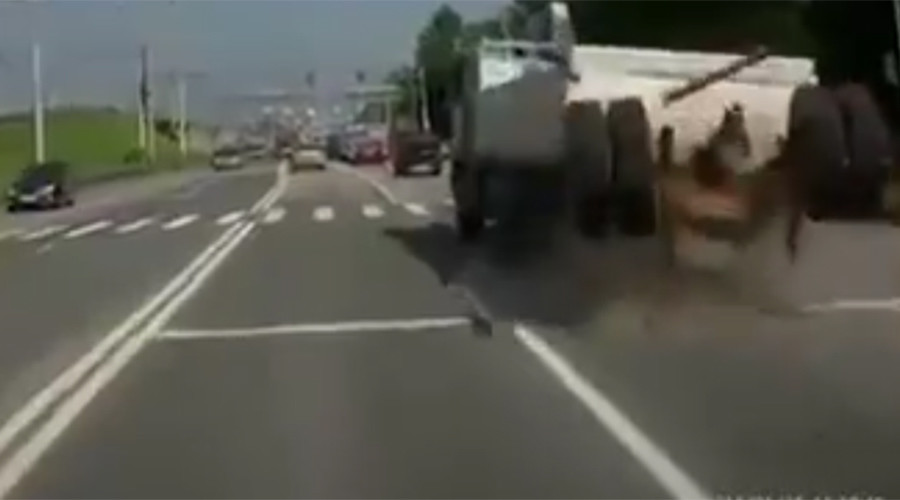 Video shows dramatic moment Russian truck's back wheels fly off on highway