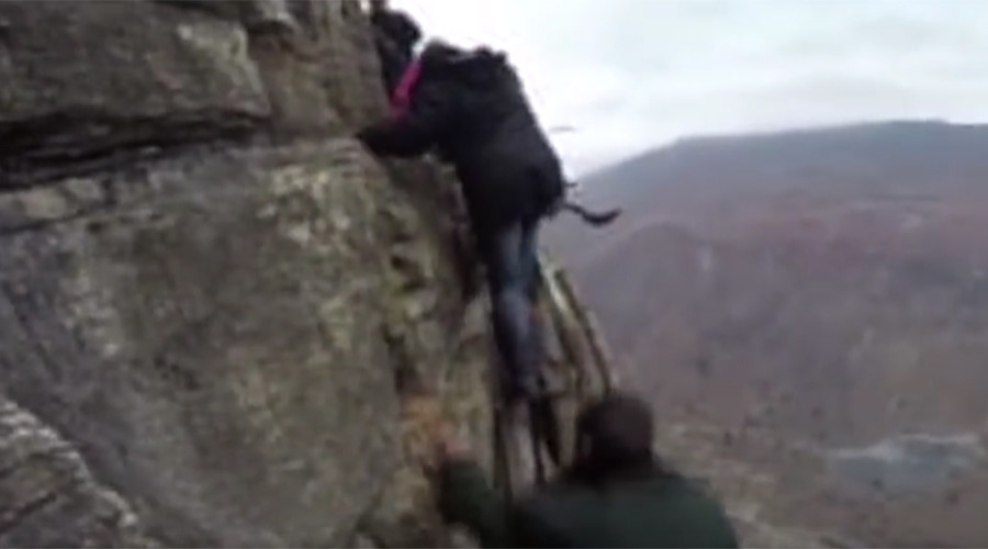 Really high school: Children tackle 800-meter high cliff en route to class (VIDEO)