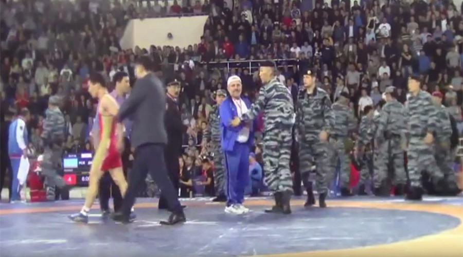 Russian riot police break up mass brawl at wrestling tournament (VIDEO)