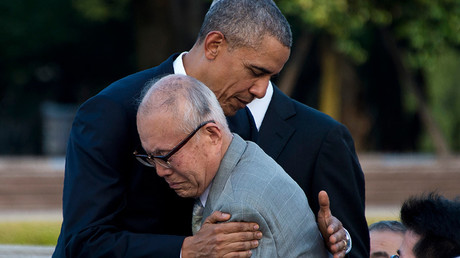 US President Barack Obama hugs Shigeaki Mori (front), a survivor of the 1945 atomic bombing of Hiroshima, during a visit to the Hiroshima Peace Memorial Park on May 27, 2016 © Jim Watson