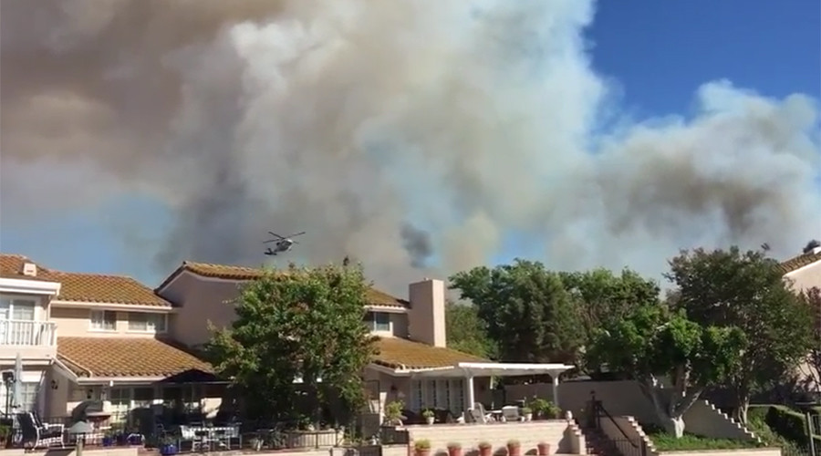 Huge California wildfire threatens homes, evacuations ordered (PHOTOS)