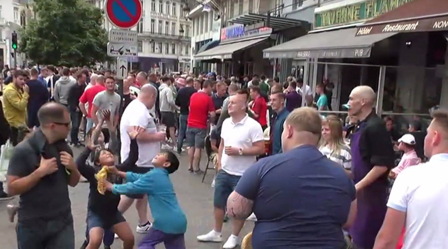Lille mayhem: English fans throw change at kids in the street to watch them fight over it (VIDEO)