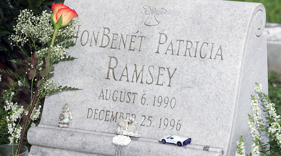 A lone rose lays at the gravesite of JonBenet Ramsey in Marietta, Georgia. © Tami Chappell