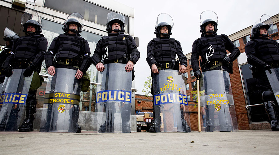 Heavy police presence as Baltimore residents grieve for slain rapper