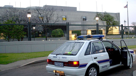 A South African police car is parked 11 September 2001 in front of the United States embassy in Pretoria © Nerrisa Korb