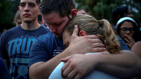 Savannah is embraced by her friend Ricky during a vigil to commemorate victims of a mass shooting at the Pulse gay night club in Orlando, Florida, U.S., June 12, 2016. © Adrees Latif