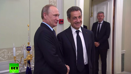 Russian President Vladimir Putin and  former French president Nicolas Sarkozy 
