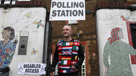 A man wearing a European themed cycling jersey leaves after voting at a polling station for the Referendum on the European Union in north London, Britain, June 23, 2016. © Neil Hall