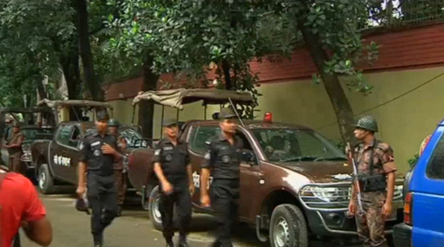 Rapid Action Battalion members walk as police stormed the Holey Artisan restaurant after gunmen attacked it and took hostages early on Saturday in Dhaka, Bangladesh in this still frame taken from live video July 2, 2016. ©