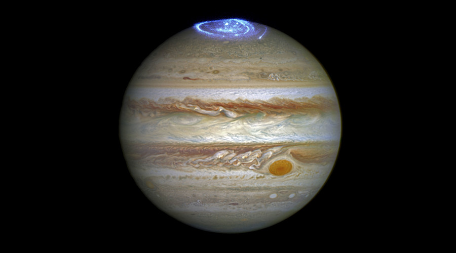 Auroras created by high-energy particles are seen on a pole of the planet Jupiter in a NASA composite of two separate images taken by the Hubble Space Telescope. © NASA