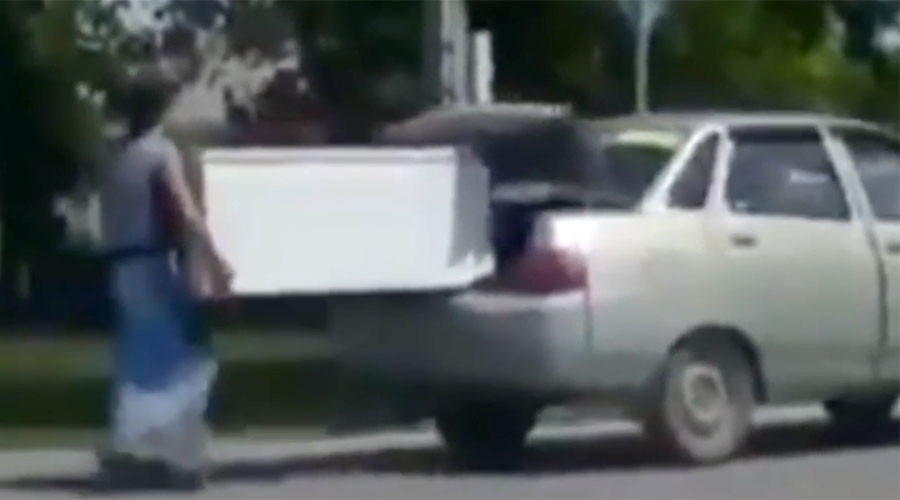 Niiice! Totally Borat moment in Kazakhstan as fiancée proves strength by carrying fridge (VIDEO)