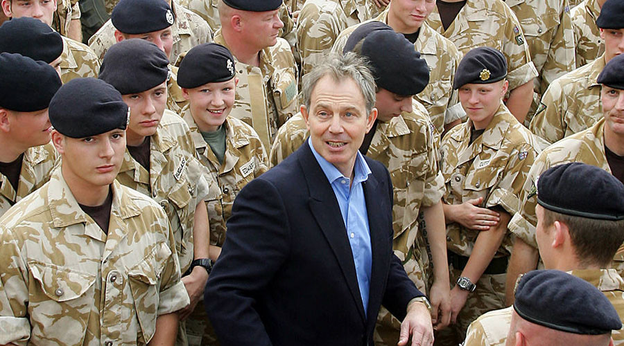 This file photo taken on December 22, 2005 shows British Prime Minister Tony Blair (C) with troops at Shaiba Logistics Base in Basra, Iraq. © Adrian Dennis