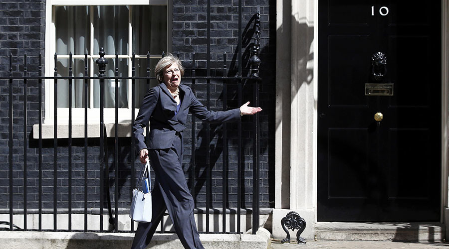 Over here, Theresa: UK's new PM gets muddled up leaving Downing St (VIDEO)
