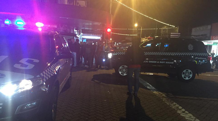 'Deliberate attack': Man sets himself alight, drives car into Sydney police station parking lot