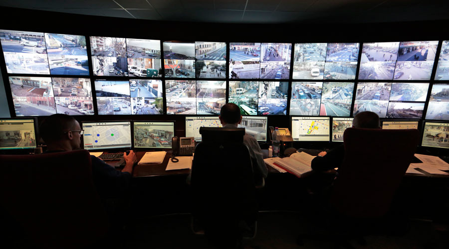 Municipal police officers watch screens in the video surveillance control room of the municipal police supervision centre in Nice © Eric Gaillard 