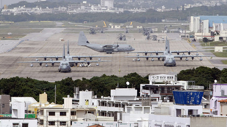 Hercules aircraft are parked on the tarmac at Marine Corps Air Station Futenma in Ginowan on Okinawa. © Issei Kato