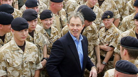 This file photo taken on December 22, 2005 shows British Prime Minister Tony Blair (C) with troops at Shaiba Logistics Base in Basra, Iraq. © Adrian Dennis