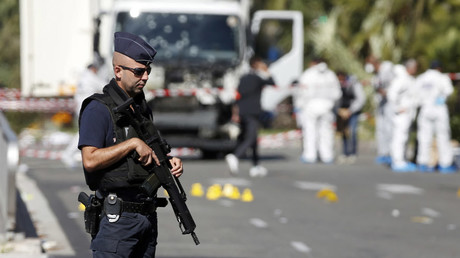 French police secure the area as the investigation continues at the scene near the heavy truck that ran into a crowd at high speed killing scores who were celebrating the Bastille Day July 14 national holiday on the Promenade des Anglais in Nice, France, July 15, 2016. © Eric Gaillard