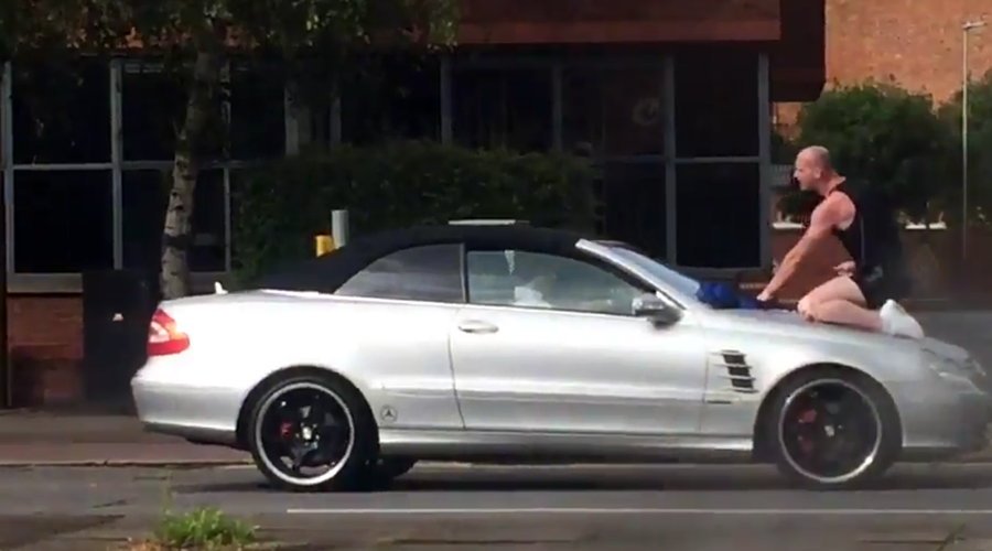 Enraged man leaps on, punches moving car during bizarre Leicester attack (VIDEO)