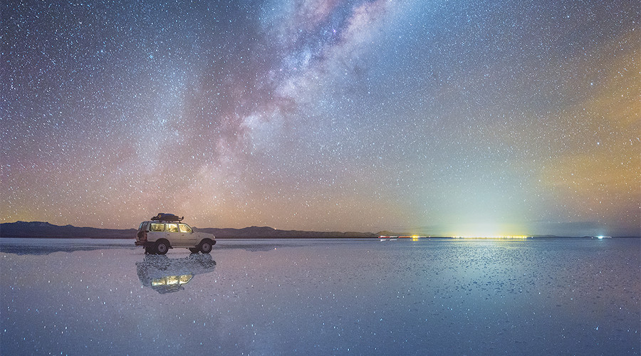 Surrounded by stars Mesmerizing Milky Way mirrored in Bolivia's salt