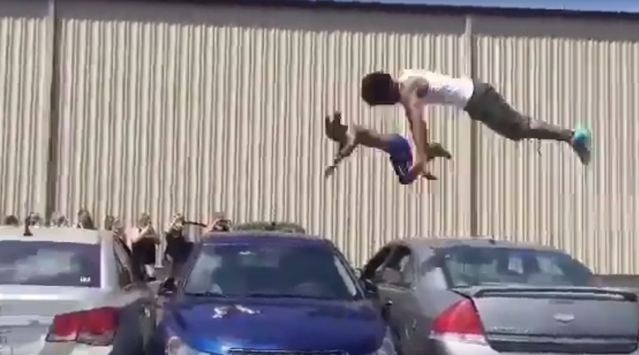 DIY Olympics: Pair of gymnasts trampoline over 3 cars (VIDEO)