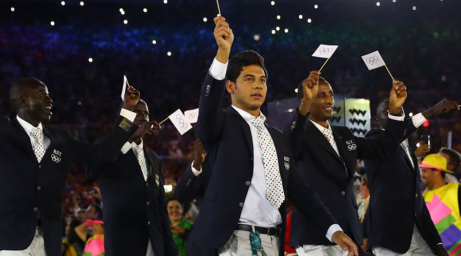 Refugee team welcomed but Olympics displace 77,000 people in Rio