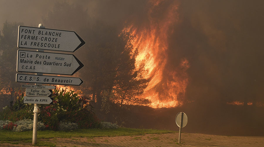 Wildfires rage near Marseille, forcing evacuations & flight diversions (PHOTOS)