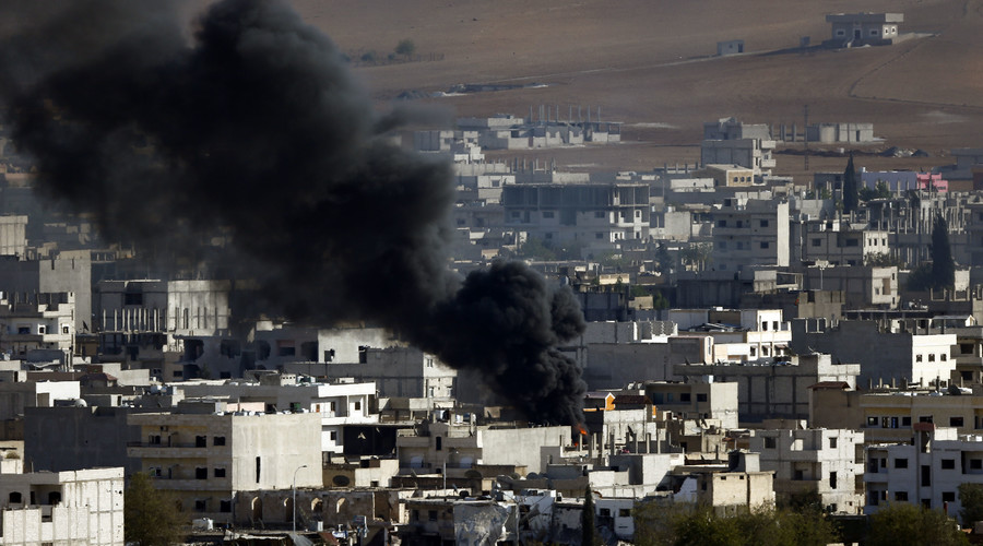 File Photo. Smoke rises from the Syrian town of Kobani. October 15, 2014. © Kai Pfaffenbach