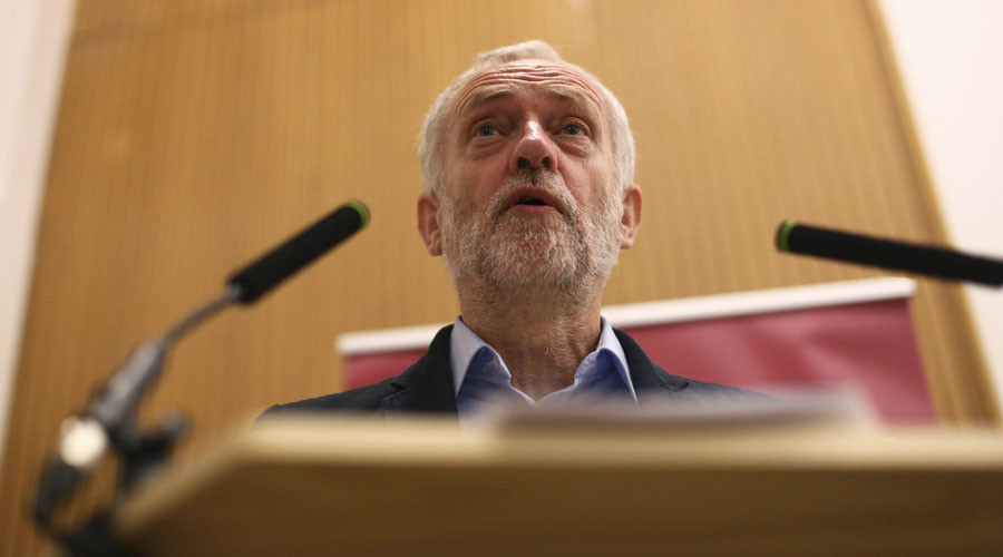 Embattled Labour leader Corbyn sits on floor with commuters for 3-hour train ride