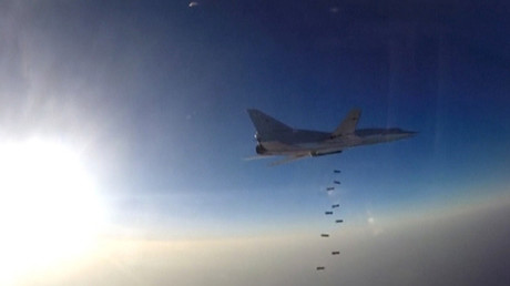 A still image, taken from video footage and released by Russia's Defence Ministry on August 16, 2016, shows a Russian Tupolev Tu-22M3 long-range bomber based in Iran dropping off bombs at an unknown location in Syria. © Ministry of Defence of the Russian Federation