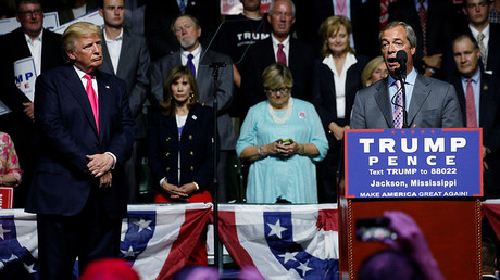 Republican presidential nominee Donald Trump (L) watches as Member of the European Parliament Nigel Farage speaks at a campaign rally in Jackson, Mississippi, U.S., August 24, 2016. © Carlo Allegri
