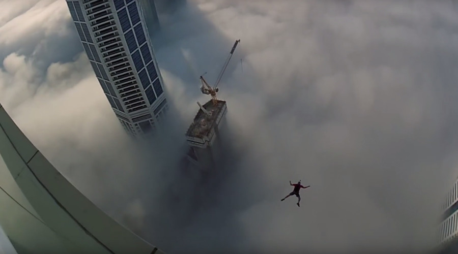 Leap of faith: Dubai base jumper makes blind plunge through clouds (VIDEO)