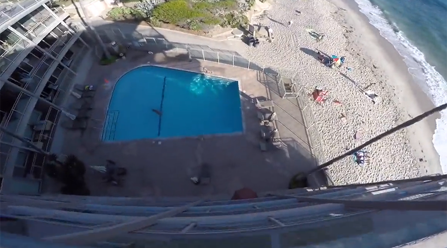Crazy multi-story swimming pool jump caught on camera (VIDEO)