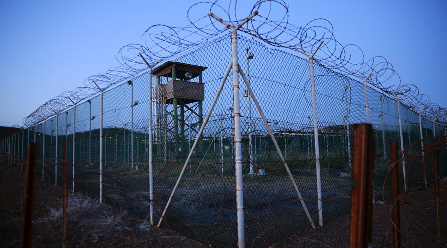 Chain link fence and concertina wire surrounds a deserted guard tower within Joint Task Force Guantanamo's Camp Delta at the U.S. Naval Base in Guantanamo Bay © Lucas Jackson