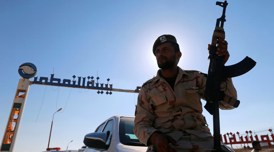 Oil edges higher on Libya unrest, output freeze possibility