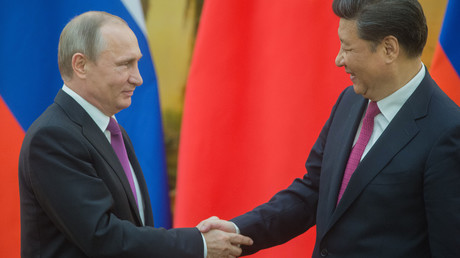 Russian President Vladimir Putin, left, and President of the People's Republic of China Xi Jinping during a signing ceremony of documents following their talks in Beijing. © Sergey Guneev