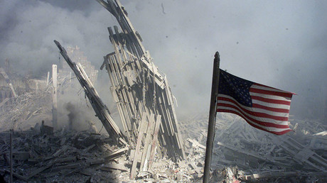 Am American flag flies near the base of the destroyed World Trade
Center in New York, September 11, 2001. © Peter Morgan