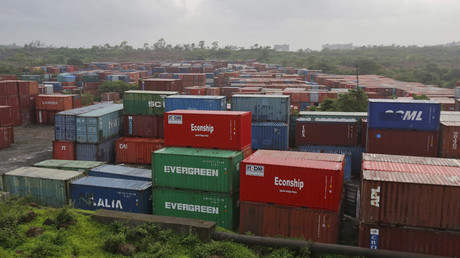 Cargo containers are seen stacked outside the container terminal of Jawaharlal Nehru Port Trust (JNPT) in Mumbai, India © Shailesh Andrade 