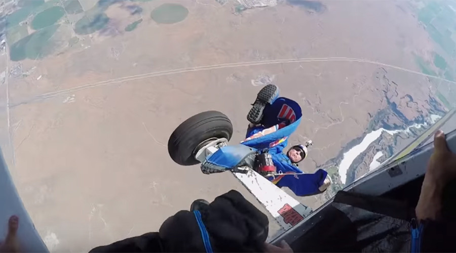Heartstopping footage captures skydiver trailing from plane in mid-air (VIDEO)